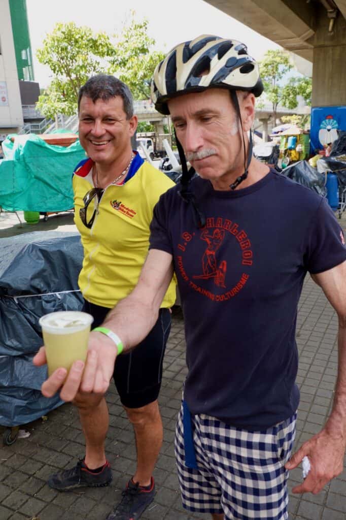 Man holding cup of juice