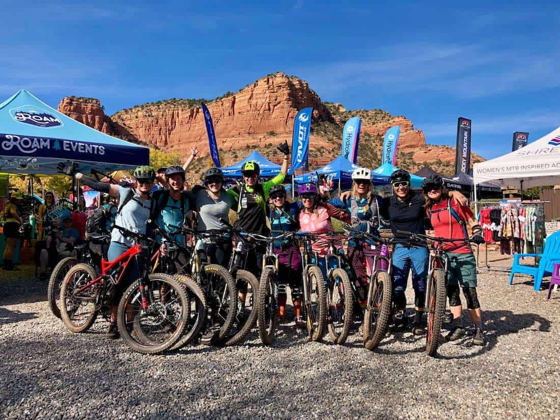 Group of women mountain bikers posing for photo and mountain bike festival in Sedona, Arizona