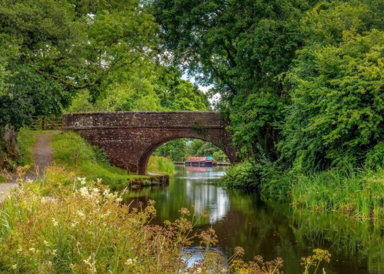 Idyllic stone bridge over Grand Western Canal in southwest England