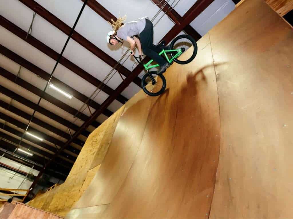 Keep your skills sharp this winter at one of these indoor bike parks featuring wooden jumps, foam pits, flow tracks, pump tracks, and more