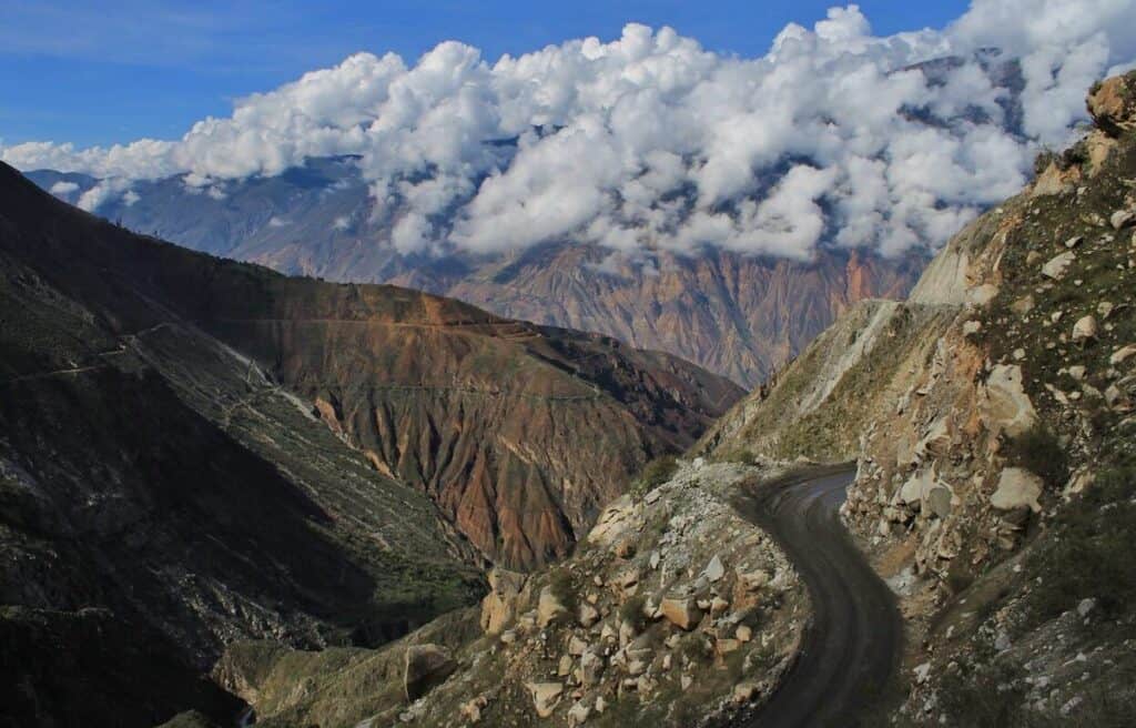 Bare mountains of the Cordillera Blanca in Peru with road cutting through