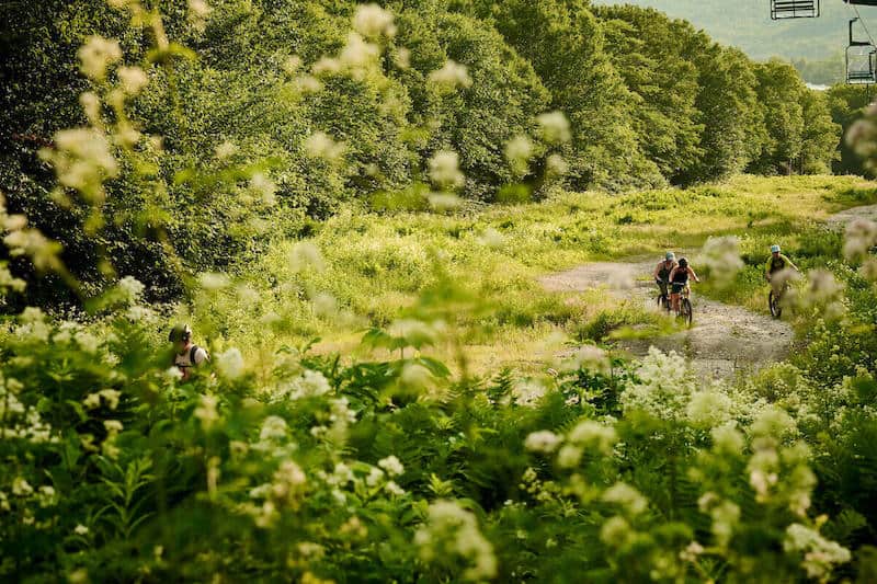 Mountain bikers on trail at Bolton Valley Bike Park in Vermont