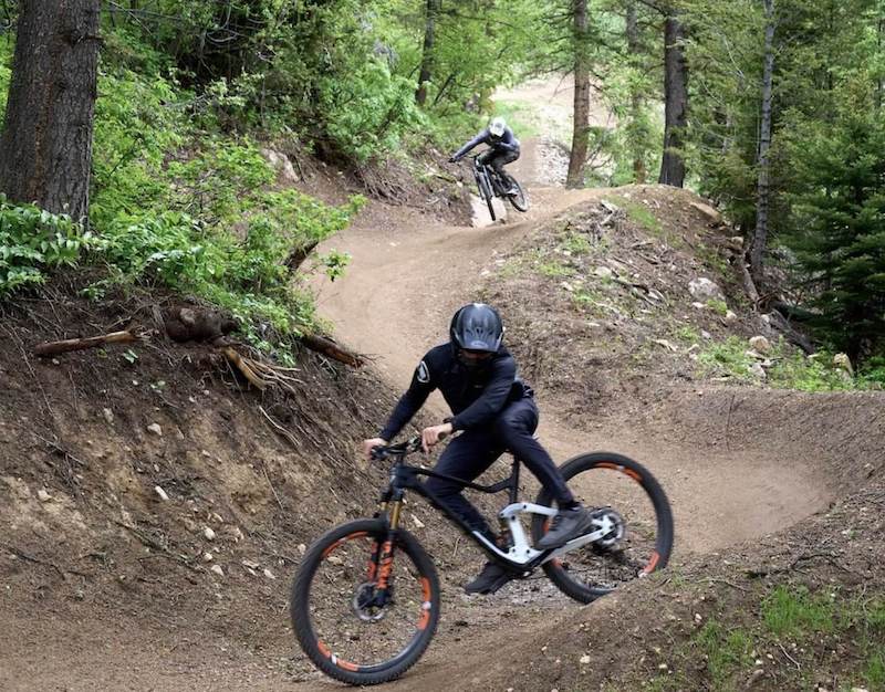 Two mountain bikers on flow trail at Jackson Hole Bike Park in Wyoming