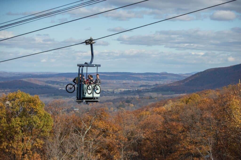 Mountain bikers on cabriolet lift at Mountain Creek Bike park in New Jersey