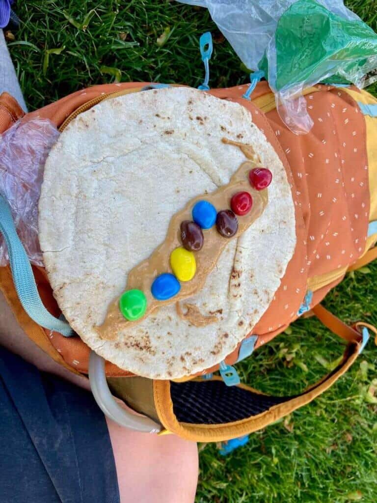 Tortilla spread with peanut butter and peanut m&m's