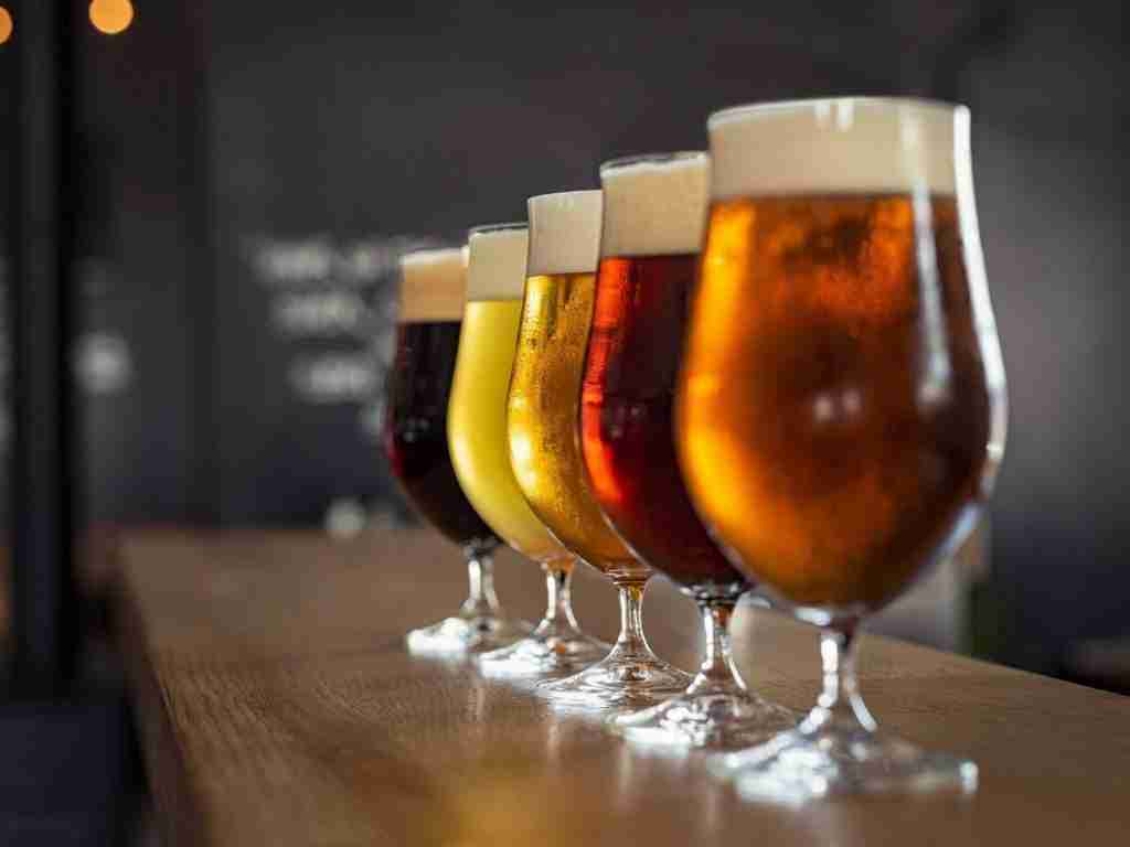 Line of draft beers on bar