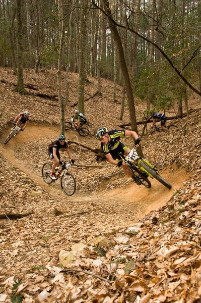Mountain bikers on flowy mountain bike trail in Kerr Scott network in North Carolina