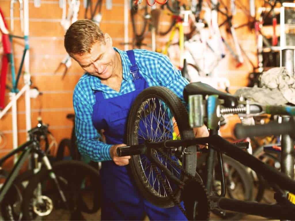 Bike mechanic working on bike in bike shop