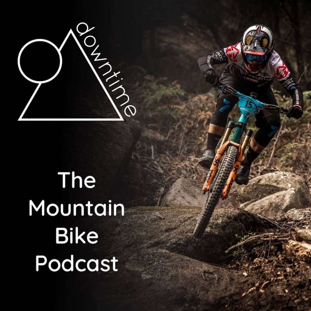 Downtime Podcast cover image with mountain biker racing down rocky trail