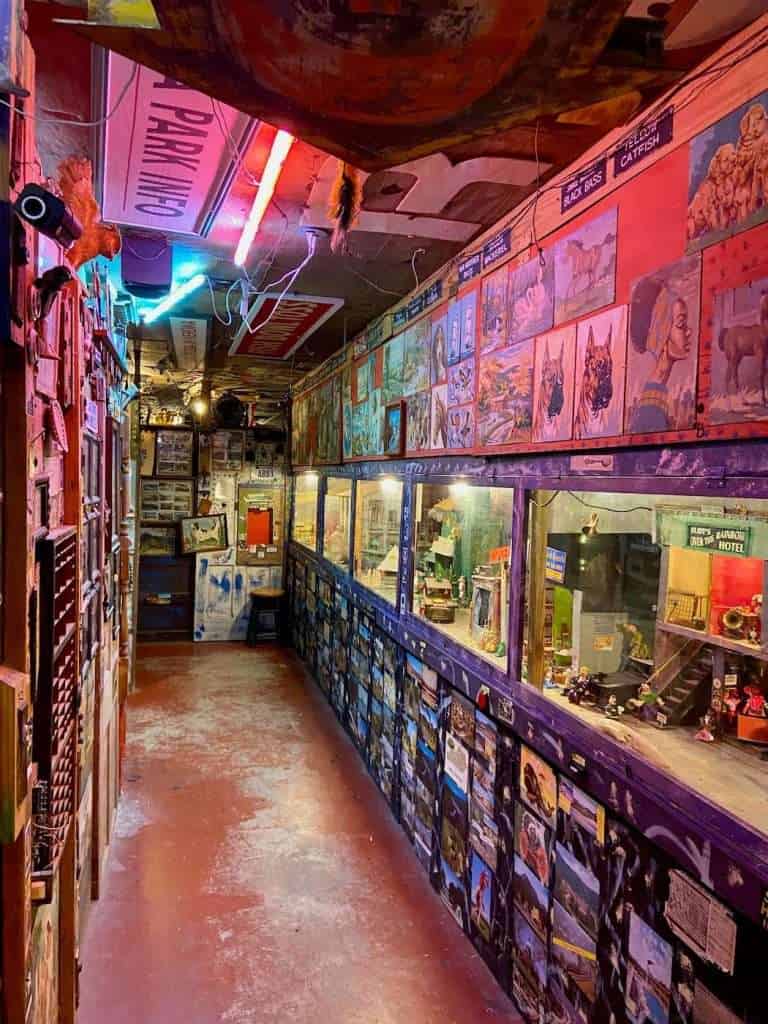 Corridor with walls filled top to bottom with recycled art and gadgets at the Mystery House museum in Abita Springs Louisiana 