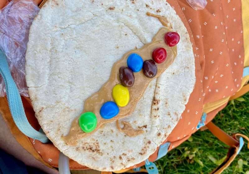 Biking snack of tortilla with peanut butter and M&M's.