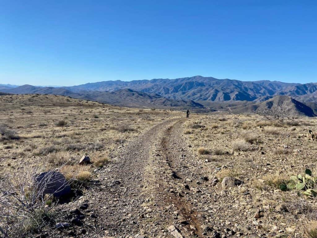 Remote doubletrack road on Black Canyon Trail in Arizona with mountain range in the distance