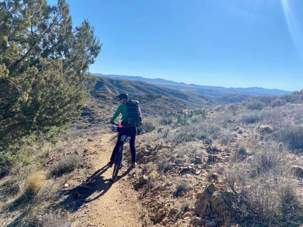 Bikepacker stopped on the Black Canyon Trail in arizona
