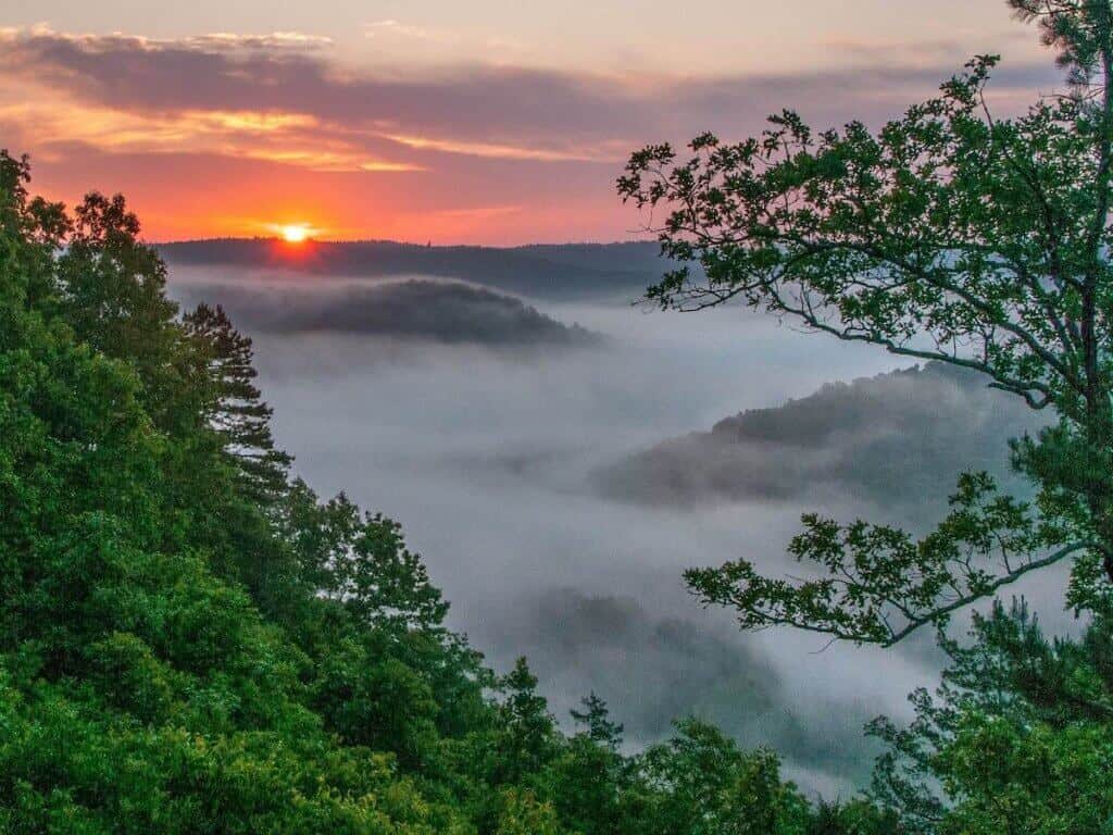 Sunset over misty mountains in Buffalo River area of Arkansas