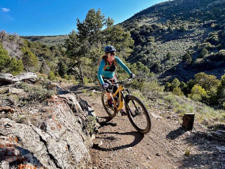 Becky riding mountain bike on singletrack trail in Ely, Nevada