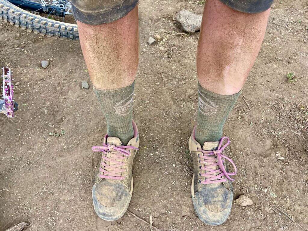 Very dirty and dusty legs of mountain biker