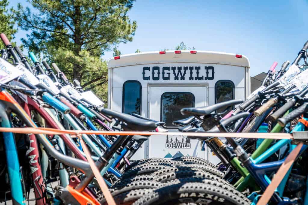Cog Wild bus shuttle pulling trailer filled with mountain bikes