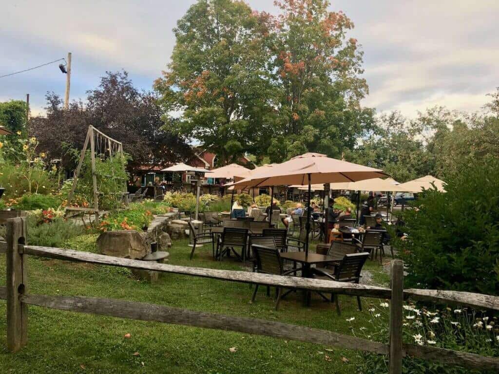 Outdoor seating in garden setting at Idletyme Brewing in Stowe, Vermont