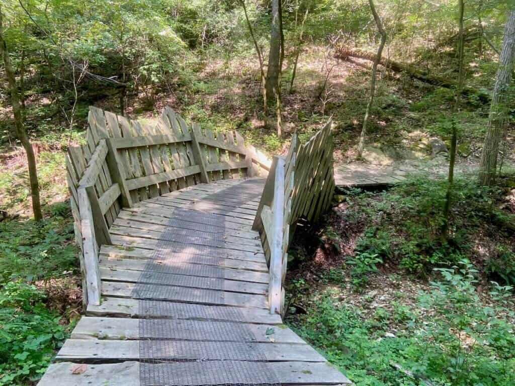Wooden bridge with tall sides on mountain bike trail in Arkansas