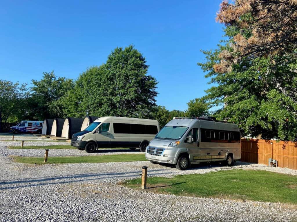 Two camper vans parked in gravel pads at the Bike in Bentonville