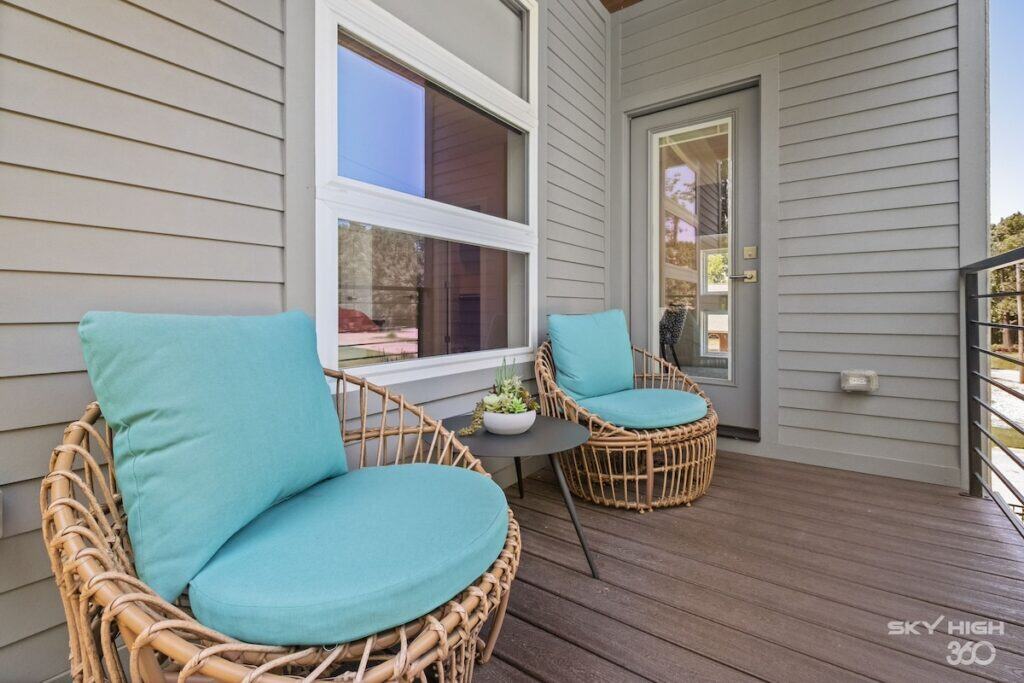 a two chairs on a porch