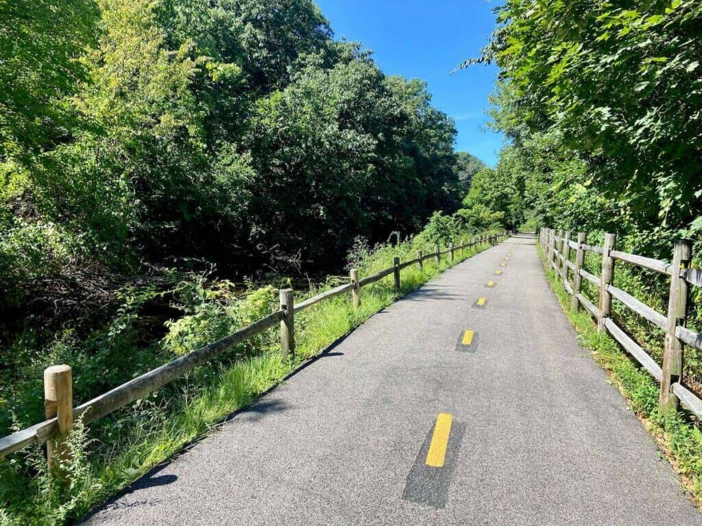 Blackstone River Bikeway multi-use path in Rhode Island lines with greenery