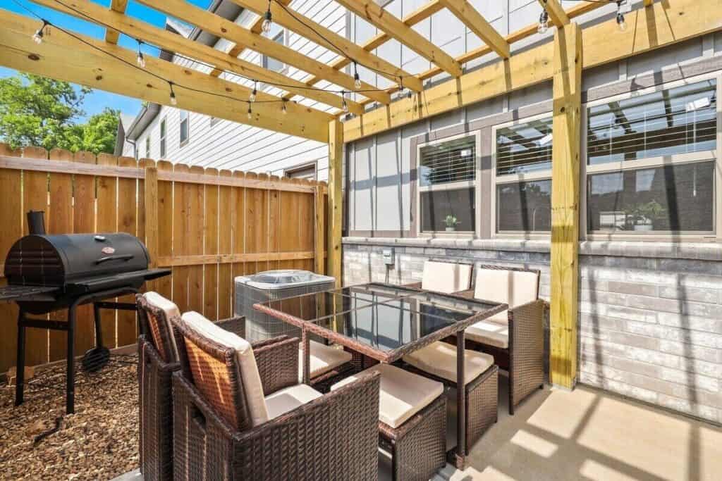 a patio with a table and chairs