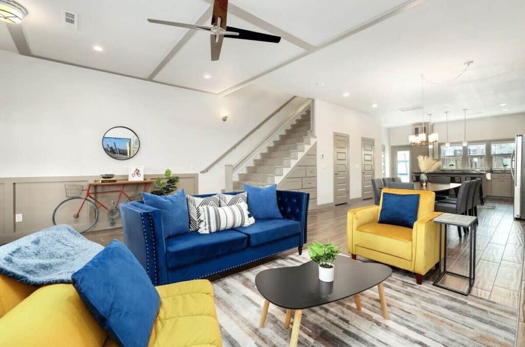 a living room with a couch and chairs