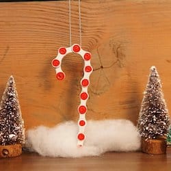 Christmas ornament of red and white candy cane made out of a recycled bike chain