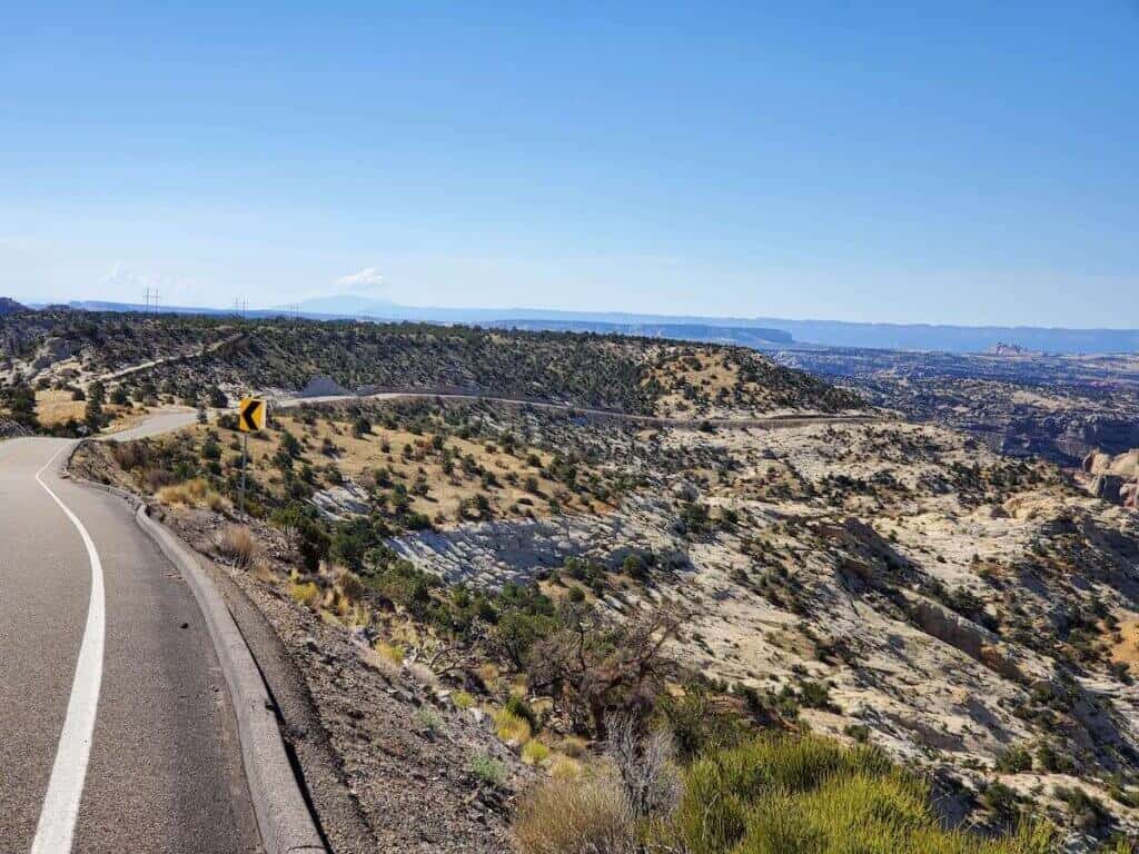 Road winding its way down Hell's Backbone highway in Utah through rock slab landscape