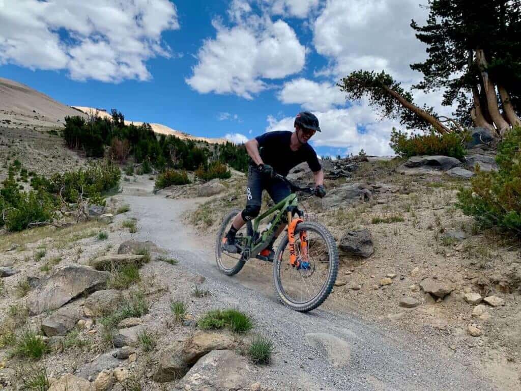 Mountain biker riding down singletrack trail at Mammoth Bike Park in California