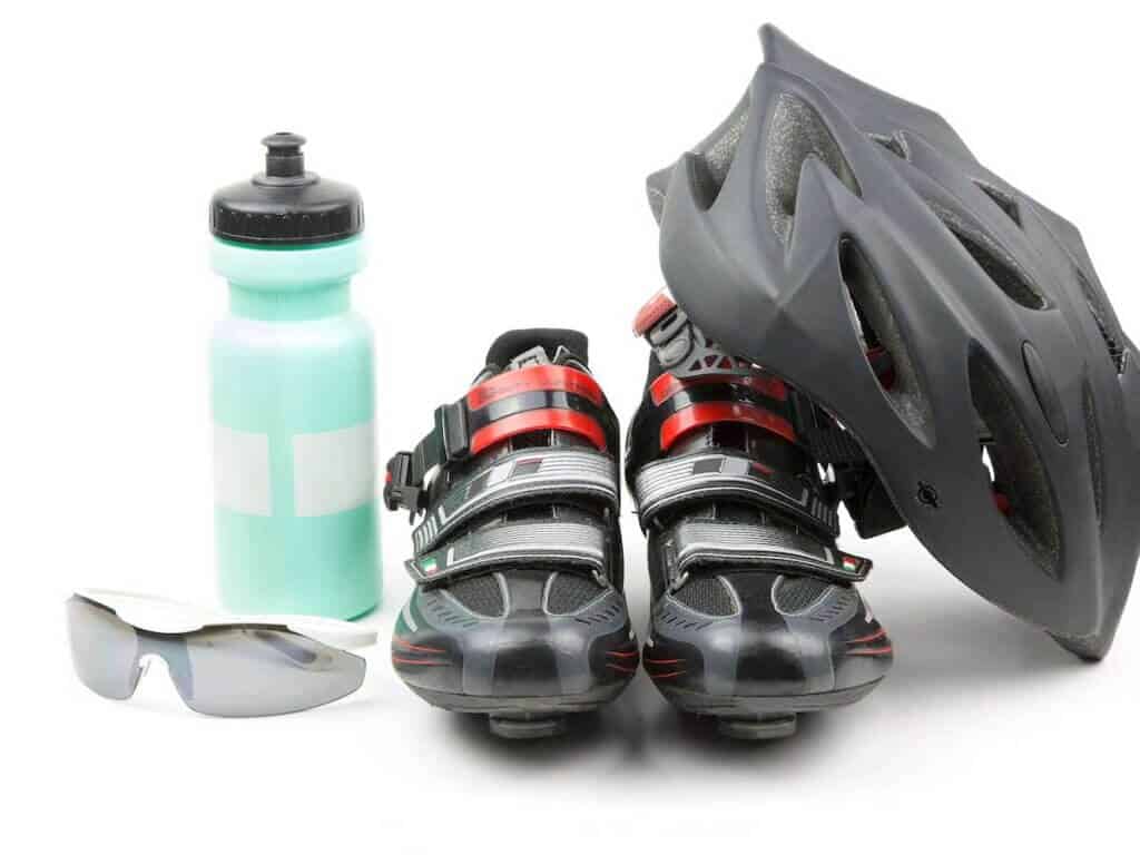 Cycling gear: helmet, shoes, water bottle, and glasses
