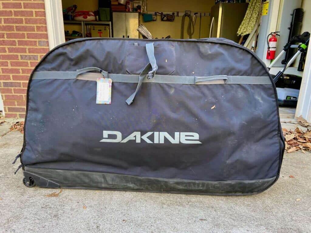 Dakine bike bag in front of open garage door