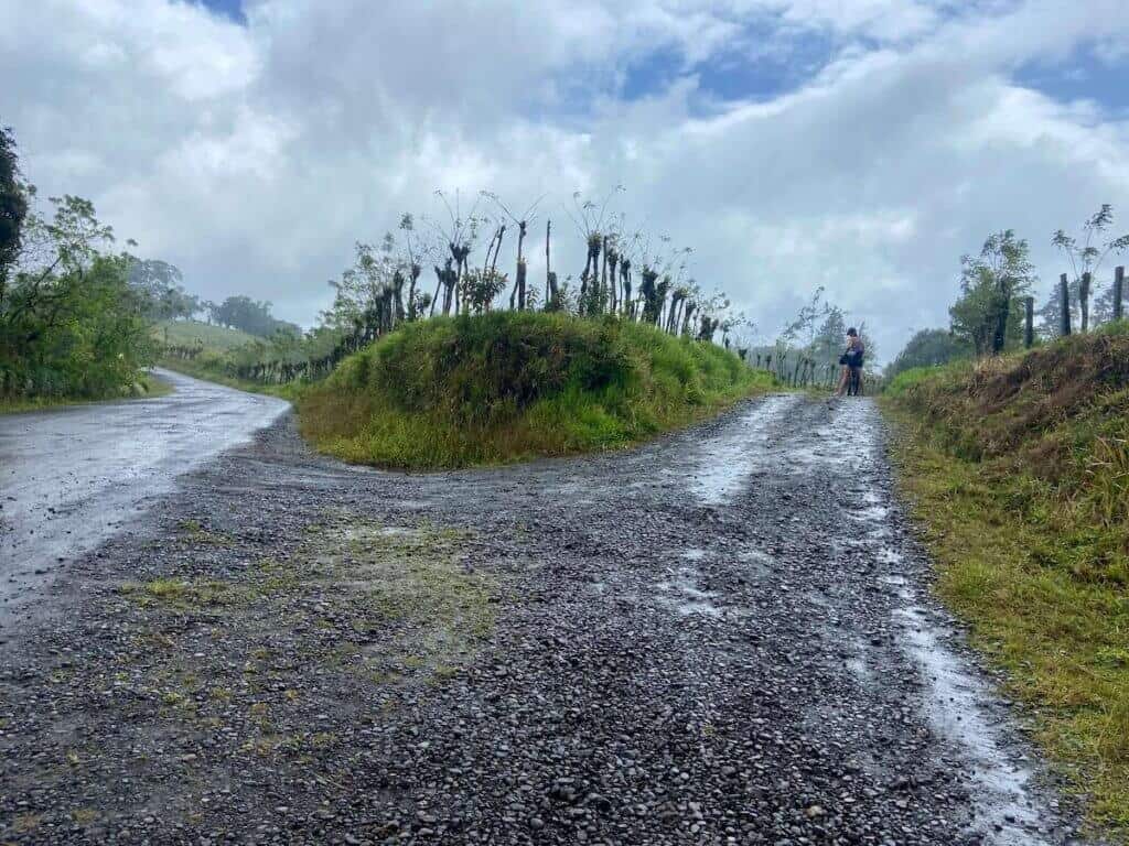 Bikepacking stopped on rain soaked road in Costa Rica