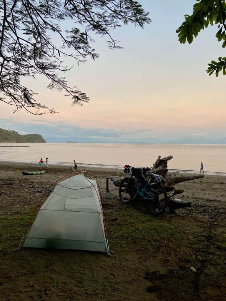 Tent set up on beach at sunset in Costa Rica