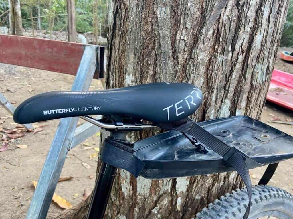 Close up of Terry Butterly Century Saddle on mountain bike with bikepacking seat post harness attached