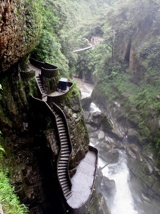 Steep stair steps down to raging river in canyon in Ecuador