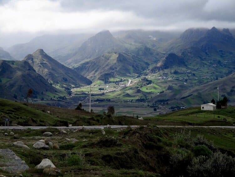 Beautiful light over Zumbahua Valley in Ecuador surrounded by tall Andes peaks