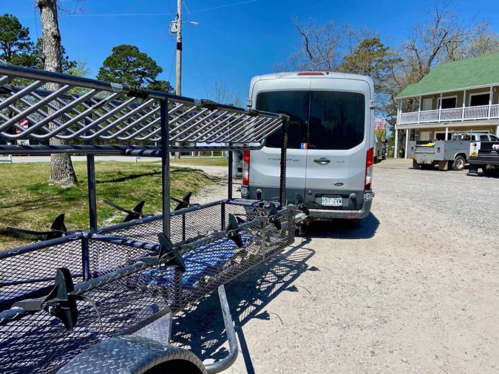 Shuttle van pulling empty mountain bike trailer at Lake Leatherwood Gravity Project in Arkansas