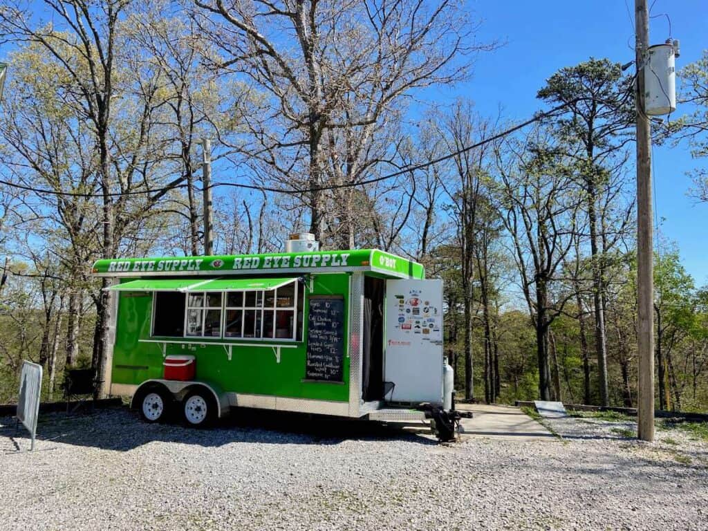 Food truck parked in gravel lot at Lake Leather Gravity Project in Arkansas
