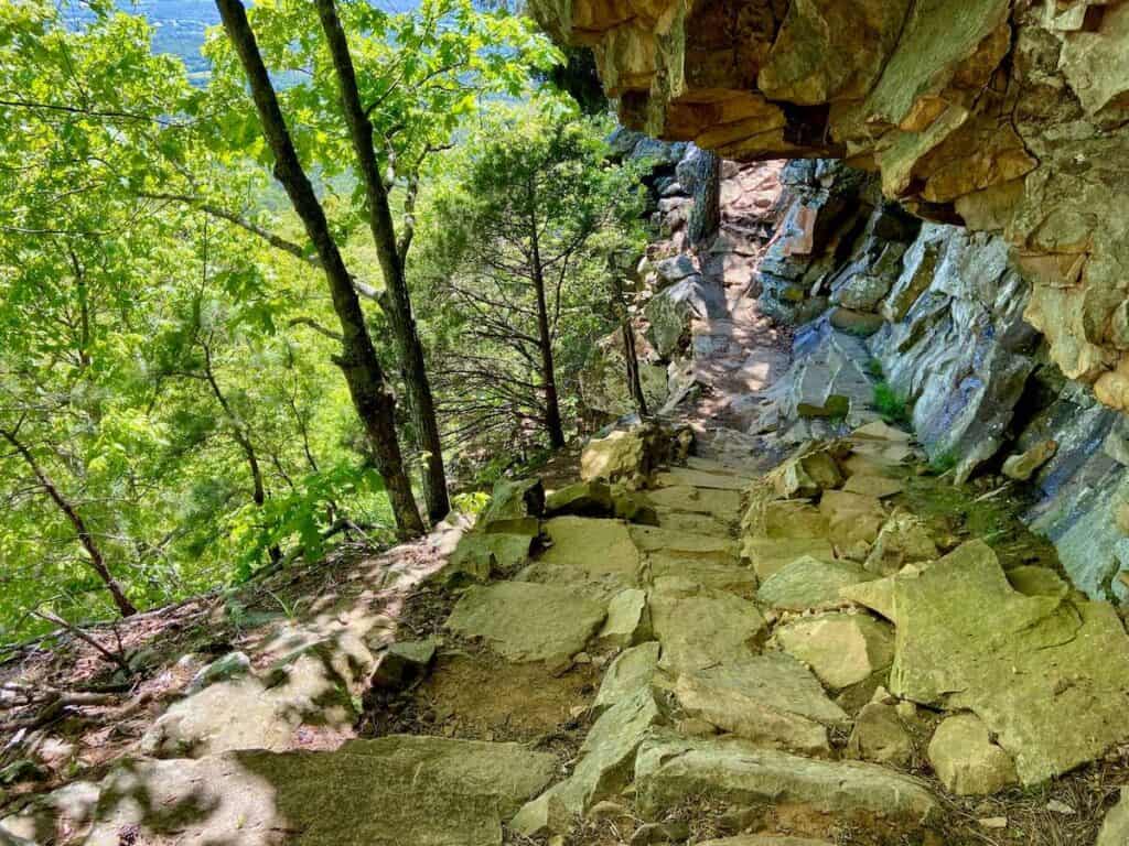 Rock armored trail under natural cliff overhang on trail at Mt. Nebo state park in Arkansas
