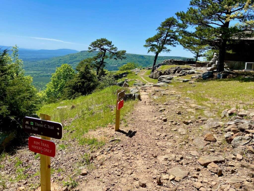Rim Trail in Mt. Nebo State Park with trail signs warning hikers only and cabin facing beautiful view
