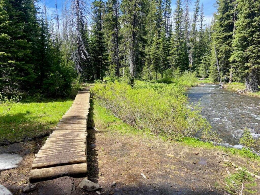 Wooden boardwalk trail next to river near Bend, Oregon