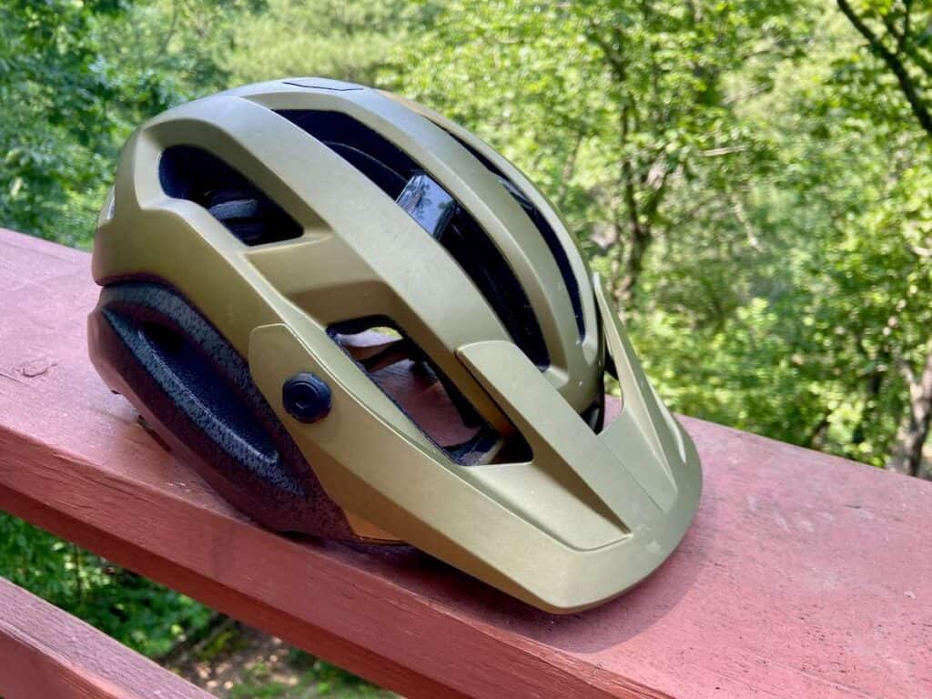 Giro Manifest mountain bike helmet sitting on porch railing