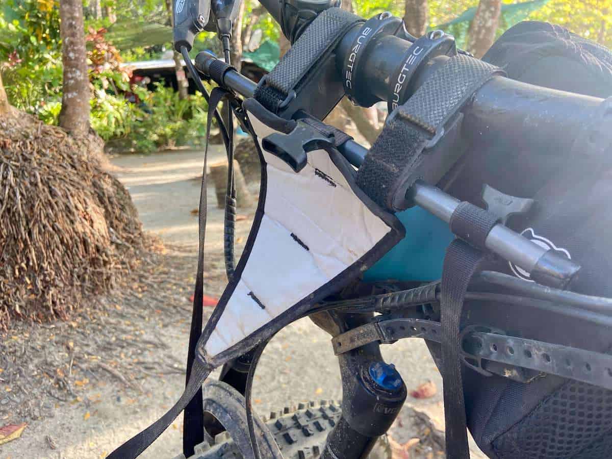 Close up photo of Rogue Panda Canelo bikepacking handlebar harness on bike