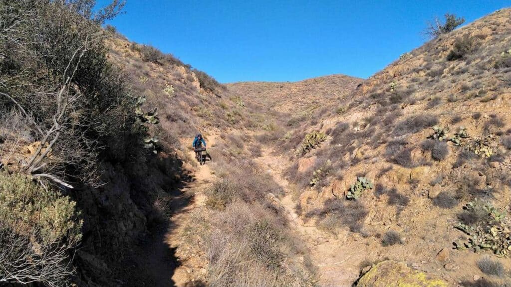 Bikepacker on singletrack section of the Black Canyon Trail in Arizona