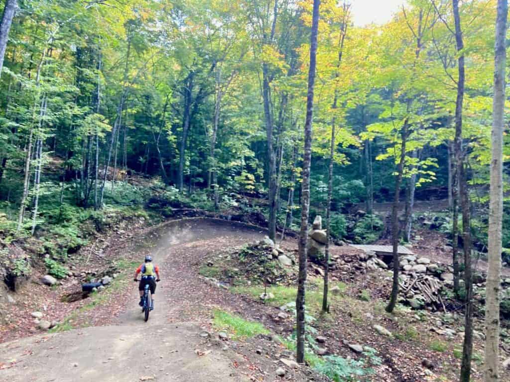 Mountain biker on wide machine-built trail at VBN Shannahan in Quebec