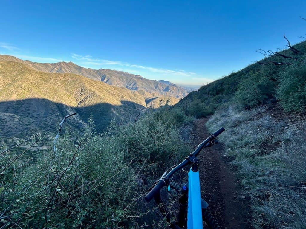 Photo out over front of mountain bike on Gridley Trail in California