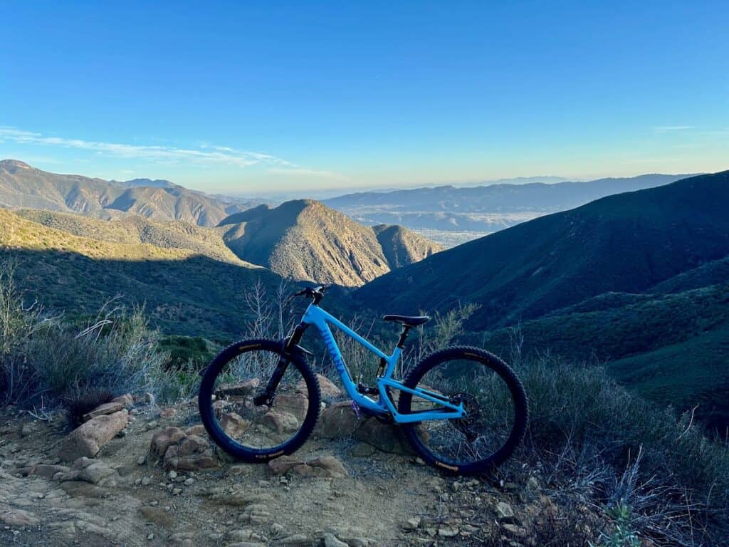 Mountain bike standing up at viewpoint on Gridley Trail in California