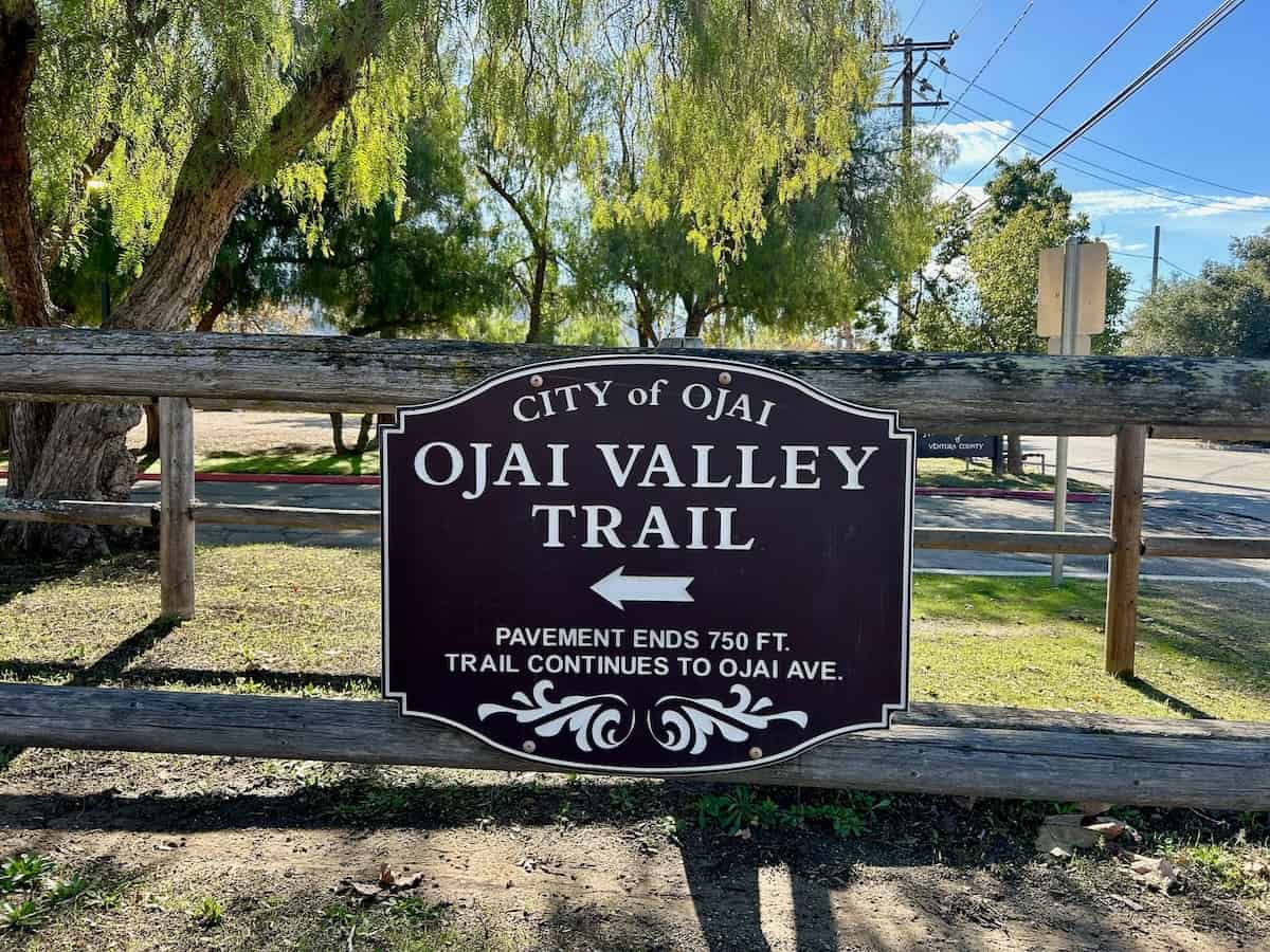Trail sign on a fence for the Ojai Valley Trail in California